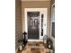 Stylish front door with decorative lanterns, and a patterned rug creating a welcoming entrance at 12453 Belmont Mansion Dr, Charlotte, NC 28273