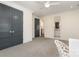 Spacious bedroom with grey carpet, double closets, doorway to bathroom and lots of natural light at 1328 S Kings Dr, Charlotte, NC 28207