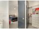 View of bedroom and closet through a doorway; includes carpet, ceiling fan, and neatly organized shelving at 1328 S Kings Dr, Charlotte, NC 28207