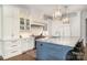 Gourmet kitchen featuring white cabinetry, marble countertops, stainless steel appliances, and a large central island at 1328 S Kings Dr, Charlotte, NC 28207