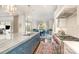 Spacious kitchen with stainless steel appliances, island seating and an open view to the dining area at 1328 S Kings Dr, Charlotte, NC 28207
