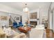 Elegant living room featuring a fireplace with a marble surround and sophisticated furnishings at 1328 S Kings Dr, Charlotte, NC 28207