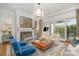 Bright living room with a fireplace, contemporary decor, and large sliding doors to the outdoor area at 1328 S Kings Dr, Charlotte, NC 28207