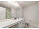 The bathroom features a large vanity, quartz countertop and a shower/tub combination with a decorative shower curtain at 1348 Southern Sugar Dr, Charlotte, NC 28262