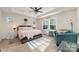 A bright and airy main bedroom boasts a tray ceiling, large windows, and stylish decor accents at 1348 Southern Sugar Dr, Charlotte, NC 28262
