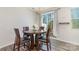 Cozy dining area with stylish table and sliding glass doors to outside at 1348 Southern Sugar Dr, Charlotte, NC 28262