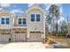 Charming townhome featuring a two-car garage and manicured landscaping at 1348 Southern Sugar Dr, Charlotte, NC 28262