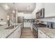 Updated kitchen with granite countertops and stainless steel appliances at 1348 Southern Sugar Dr, Charlotte, NC 28262