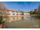 Townhomes with backyard pond and fountain; offers a serene and picturesque outdoor living experience at 14106 Yachtsman Harbor Dr, Charlotte, NC 28278