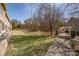 Backyard view featuring a pond with a fountain and landscaped yard at 14106 Yachtsman Harbor Dr, Charlotte, NC 28278