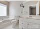Bright bathroom features white vanity, tub, and tile floors at 14106 Yachtsman Harbor Dr, Charlotte, NC 28278
