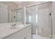 Bright bathroom features white vanity, shower, and tile floors at 14106 Yachtsman Harbor Dr, Charlotte, NC 28278