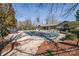 Community pool with lounge chairs and clubhouse; a perfect retreat for relaxation and leisure at 14106 Yachtsman Harbor Dr, Charlotte, NC 28278