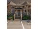 Charming condo with a gray front entrance with well-maintained landscaping at 14106 Yachtsman Harbor Dr, Charlotte, NC 28278