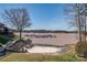 Lakefront features a sandy beach and dock; a picturesque setting with easy access to water activities at 14106 Yachtsman Harbor Dr, Charlotte, NC 28278