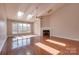 Bright living room with vaulted ceilings, fireplace, hardwood floors, and large windows at 14106 Yachtsman Harbor Dr, Charlotte, NC 28278