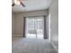 Spacious main bedroom with neutral carpet and sliding door to screened in porch at 14106 Yachtsman Harbor Dr, Charlotte, NC 28278