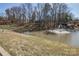 Scenic pond view featuring a fountain and surrounded by trees at 14106 Yachtsman Harbor Dr, Charlotte, NC 28278