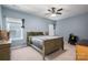 Bedroom with ceiling fan, blue walls, and 2 windows at 146 Stibbs Cross Rd, Mooresville, NC 28115