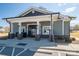 Community clubhouse featuring a gated entry and stone pillar accents near the parking lot at 146 Stibbs Cross Rd, Mooresville, NC 28115