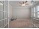 Bright office with a ceiling fan, neutral walls, carpeted floors and French doors at 146 Stibbs Cross Rd, Mooresville, NC 28115