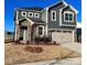 Charming two-story home with stone facade, gray siding, and attached two-car garage at 1463 Honey Trl, Monroe, NC 28112