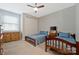 Cozy bedroom with two beds, a ceiling fan, a closet, and a window for natural light at 1496 Imperial Ct, York, SC 29745