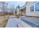 Back of house features a large patio, hot tub, and backyard at 1750 Williamsburg Dr, Rock Hill, SC 29732