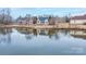 Scenic backyard view with lake access, complemented by lush landscaping and tranquil water reflections at 1750 Williamsburg Dr, Rock Hill, SC 29732
