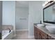 Bathroom with double sink vanity, tiled floor, and a large soaking tub at 1750 Williamsburg Dr, Rock Hill, SC 29732