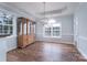 Dining area featuring hardwood floors, tray ceiling, and decorative lighting at 1750 Williamsburg Dr, Rock Hill, SC 29732