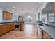 Open kitchen and dining area with wood floors, stainless appliances and large windows at 1750 Williamsburg Dr, Rock Hill, SC 29732
