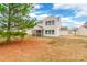 A sprawling backyard showcases a screened porch and lush greenery surrounding the property at 1938 Mallard Pointe Dr, Kannapolis, NC 28083