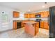 Efficient kitchen featuring an island, black appliances, and lots of cabinet space at 1938 Mallard Pointe Dr, Kannapolis, NC 28083