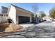 A modern townhouse features a spacious two-car garage and neutral exterior at 19843 Lamp Lighters Way, Cornelius, NC 28031