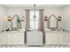 Stylish bathroom with double vanities, decorative mirrors, and a neutral color palette at 2016 Thatcher Way, Fort Mill, SC 29715