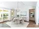 Elegant dining room with chandelier, stylish furnishings, and access to outdoor space at 2016 Thatcher Way, Fort Mill, SC 29715
