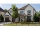 Beautiful white brick home featuring a meticulously landscaped front yard and a convenient two-car garage at 2016 Thatcher Way, Fort Mill, SC 29715