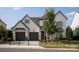 Charming two-story home featuring a manicured front lawn, black fencing, and a two-car garage at 2016 Thatcher Way, Fort Mill, SC 29715