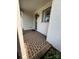 Covered front porch with decorative brick flooring, offering a welcoming entrance to the home at 2016 Thatcher Way, Fort Mill, SC 29715