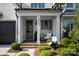 Inviting front porch with a chair, brick floor, and view of the lush landscaped front yard at 2016 Thatcher Way, Fort Mill, SC 29715