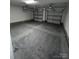 Spacious two car garage with overhead lighting, ready for storage and parking at 2016 Thatcher Way, Fort Mill, SC 29715