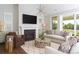 Cozy living room featuring a fireplace, plush seating, and elegant decor at 2016 Thatcher Way, Fort Mill, SC 29715