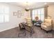 Stylish home office featuring built-in shelving, neutral decor, and bright window at 2016 Thatcher Way, Fort Mill, SC 29715