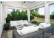 Cozy covered patio with comfortable seating, perfect for outdoor relaxation and entertaining at 2016 Thatcher Way, Fort Mill, SC 29715