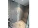 Modern shower with dual shower heads, gray tiled walls, and a built-in bench at 2016 Thatcher Way, Fort Mill, SC 29715