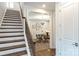 Elegant staircase with wood treads and iron balusters, leading to a home office at 2016 Thatcher Way, Fort Mill, SC 29715