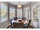 Charming breakfast nook with large windows, a round table, and seating for five at 2024 Woodshorn Dr, Matthews, NC 28104