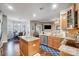 Well-lit kitchen features granite counters, stainless steel appliances, and a breakfast bar at 2024 Woodshorn Dr, Matthews, NC 28104