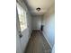 Mud room with wood grain flooring and a white exterior door at 206 Lincoln St, Badin, NC 28001